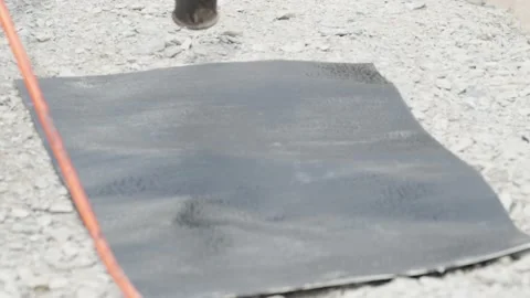 Installation of protective waterproofing on the foundation and walls of the Stock Footage 239006004