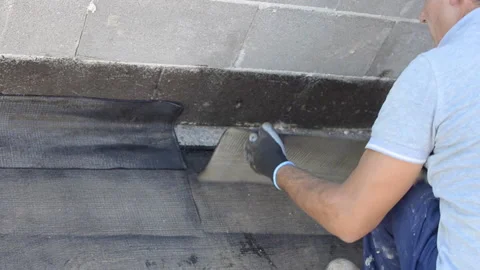 Installation of roll roofing waterproofing propane blowtorch during construct Stock-Footage 142527273