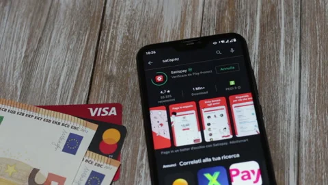 Installation of the Satispay app in the Google Play Store on the smartphone Stock Footage 150306119