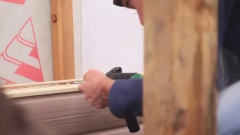 Installation of siding Stock Footage 80210522