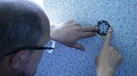 Installation of the socket inside the wall Stock Photos
