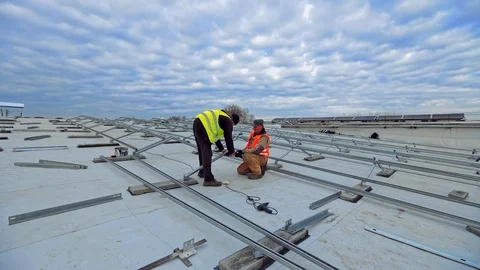 Installation of solar power plant on flat roof.  Stock Footage 128240554