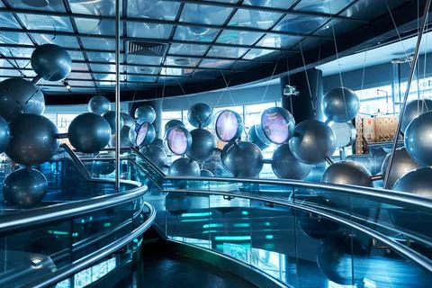 Installation of stylish connected silver balls decoration modern interior in  Stock Photos