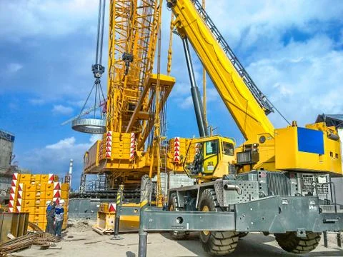 Installation of technological equipment on the construction site, using a cra Stock Photos