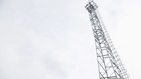 Installation of transmission lines at construction site Stockbeeldmateriaal 182158946