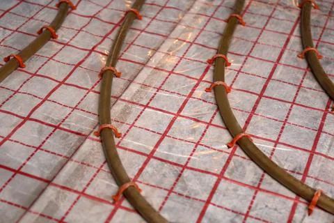 Installation of underfloor heating system in building Fotos de archivo