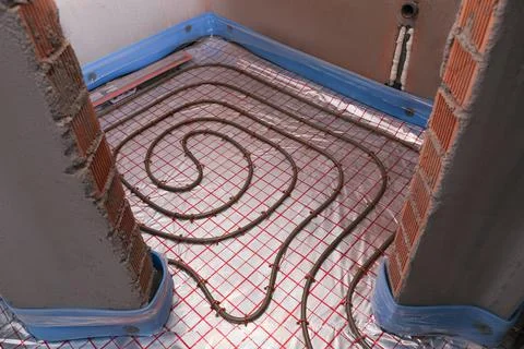 Installation of underfloor heating system in building Fotos de archivo