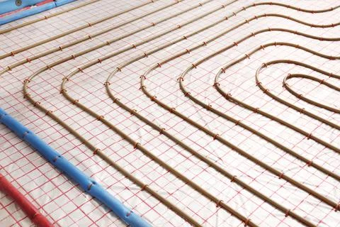 Installation of underfloor heating system in building Fotos de archivo