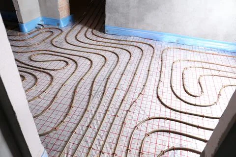 Installation of underfloor heating system in building Fotos de archivo