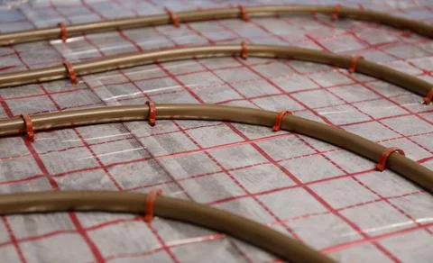 Installation of underfloor heating system in building Fotos de archivo