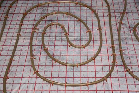 Installation of underfloor heating system in building Fotos de archivo