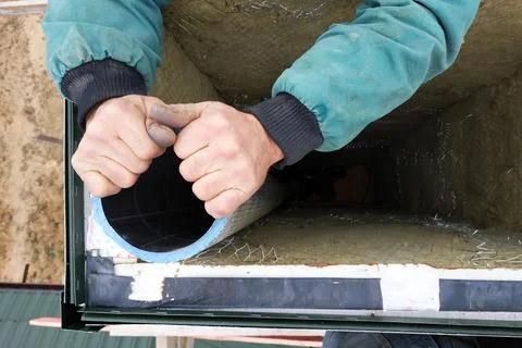 Installation of ventilation system in the house, fixing the ventilation pipe  Stock Photos