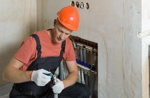 Installation of a warm floor. Stock Photos