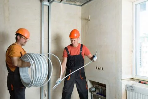Installation of a warm floor. Stock Photos