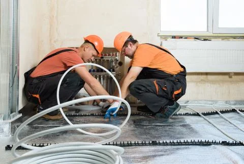 Installation of a warm floor. Foto stock