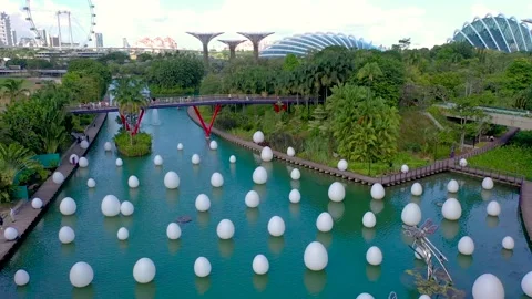 Installation of white eggs floating in water. Eggs are among seven interactive 스톡 동영상 146624869