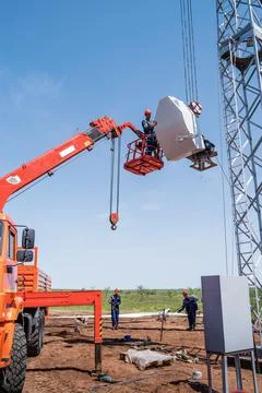 Installation of a wind generator using a crane and aerial platform Stock Photos