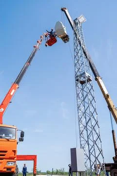 Installation of a wind generator using a crane and aerial platform Stock Photos