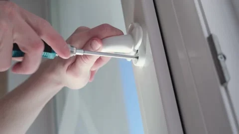 Installation of a window handle Stock Footage 152613001
