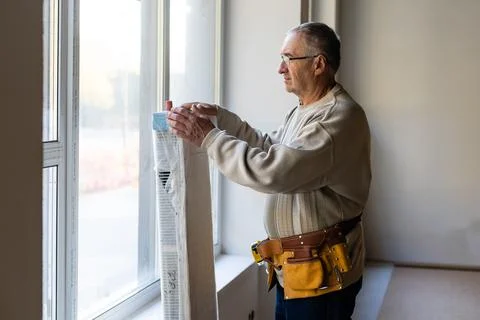 Installation of window in the office. window customizer Stock Photos