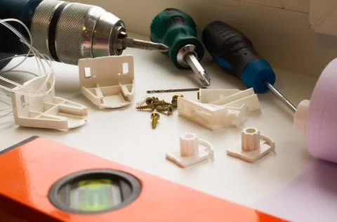Installation of a window roller with a holder. Installation tool. Screwdrivers,  Stock Photos