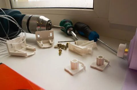 Installation of a window roller with a holder. Installation tool. Screwdrivers,  Stock Photos