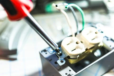 Installation wire in to a plug. Stock Photos