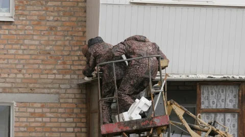 Installation Work On A Construction Building Site By Means Of Crane Stock Footage 195001172