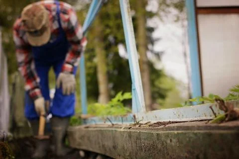Installation work to hammer a nail Stock Photos