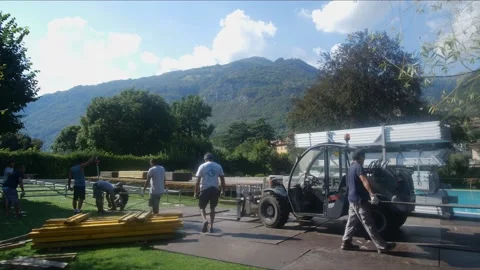 Installation work. Installation of flooring on the street. Aluminum construction Stock Footage 131775514