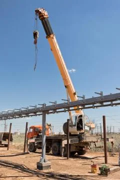 Installation work in a restricted area with use of crane Stock Photos