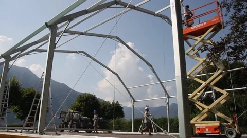 Installation work. Temporary structure on the lake shore. Aluminum construction Stock Footage 131021698