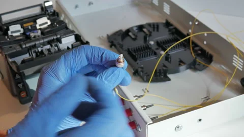 Installation of a yellow fiber optic cable Stock Footage 91040175
