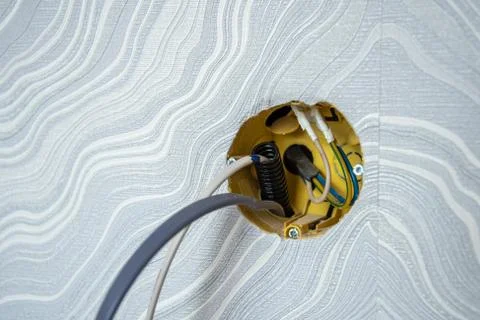 Installation of yellow wall sockets with cable Stock Photos