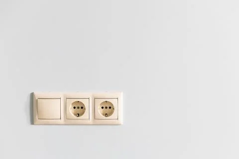 Installed electrical sockets on plastered wall Stock Photos