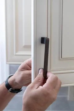 Installed kitchen cabinet handles Stock Photos