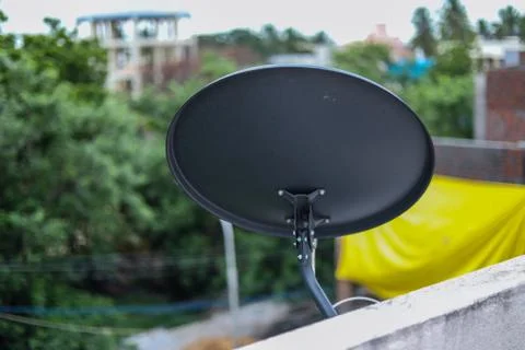 Installed Satellite dish or DTH or Direct to home tv on the roof. Stock Photos