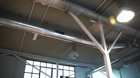 Installed ventilation system in workspace with big windows and ceiling hanging Video stock 250484692