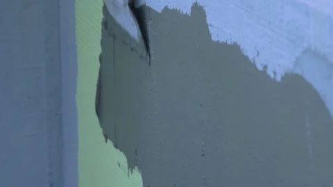 Installed yellow styrofoam insulation sheets on building wall Stock Footage 323265693