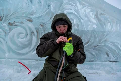 The installer isolates the ends of the power cable 스톡 사진