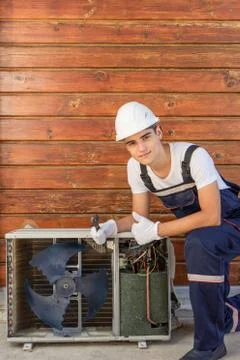 Installer of split heating systems. Repairman of inverter air conditioners Stock Photos