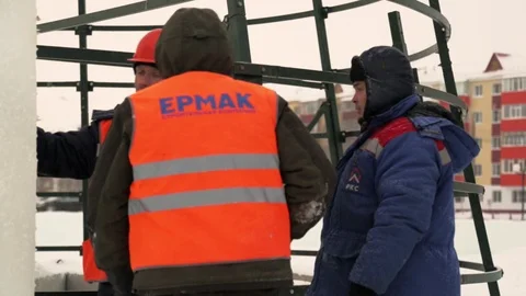 Installers at the construction of the ice town Stock Footage 106700598