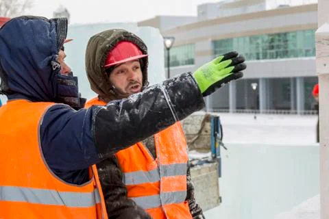Installers at the construction of the ice town 스톡 사진
