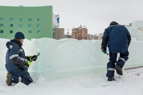 Installers at the construction of the ice town 스톡 사진