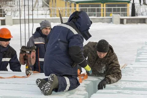 Installers unloading ice blocks for an ice town 스톡 사진