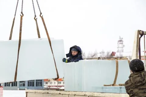Installers unloading ice blocks for an ice town 写真素材