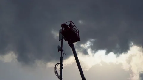 Installing 5g cellular communication equipment on the tower Stock Footage 132296030