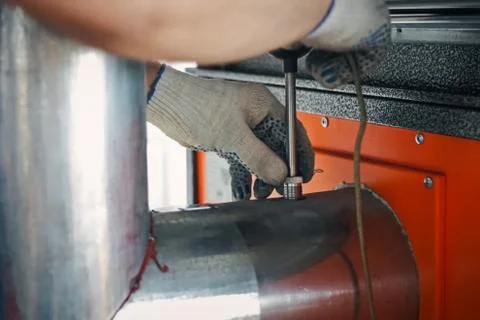 Installing air thrust sensor on the tube. Stock Photos