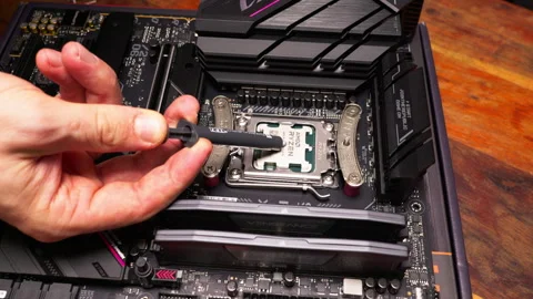 Installing AMD Ryzen CPU with thermal paste. Ideal for technology tutorials. Stock Footage 301785080