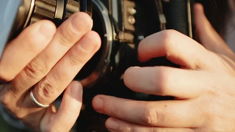 Installing and configuring a lens on a medium format camera Stock Footage 105489240